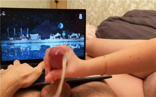 Playing PC games while handjob