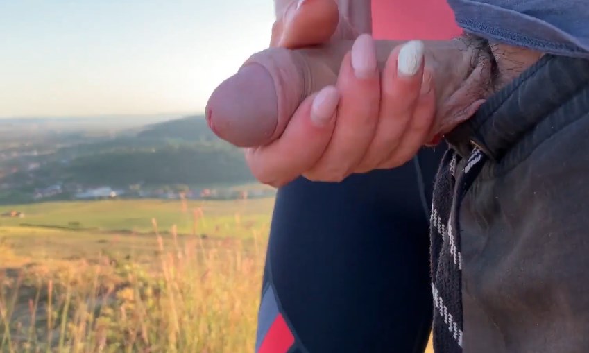 She give handjob on a public hiking trail near many houses 