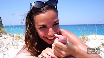 Sexy brunette give blowjob and rides on cock on public beach