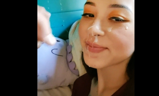 Cumshot on pretty japanese face 