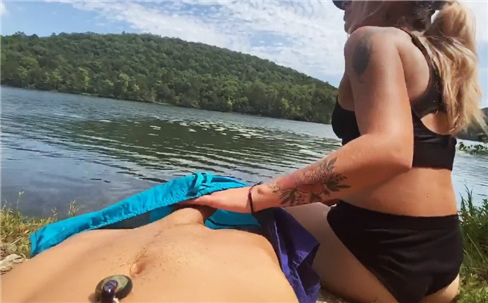 Outdoor handjob under pants at lake