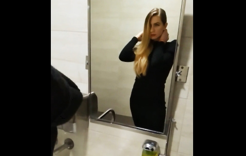 Sexy blonde gives blowjob in public toilet
